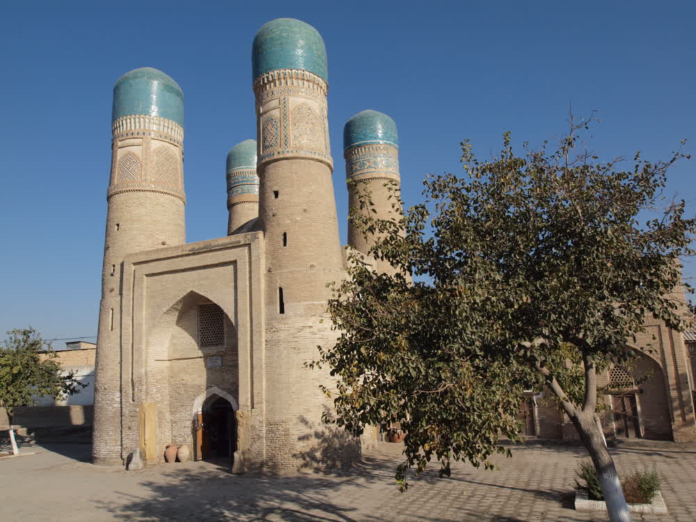 Chor-Minor in Bukhara, a squat gatehouse topped with four blue-domed towers