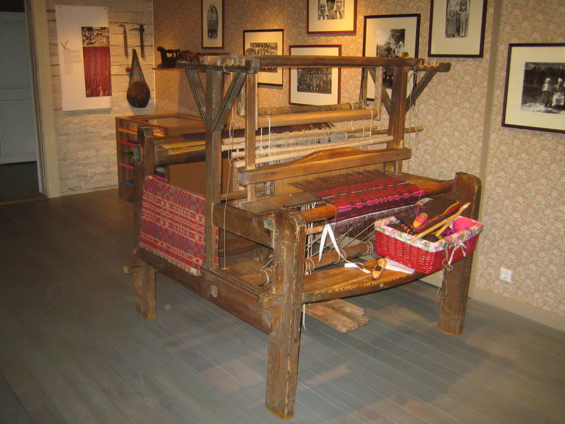 A wooden handloom strung with warp threads in the Kihnu museum.