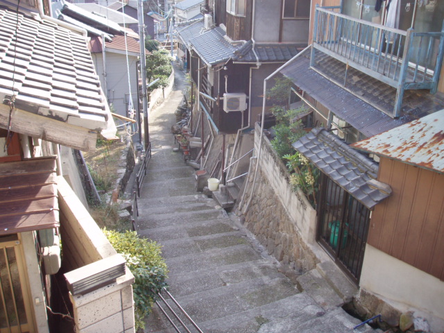 A steep stone path between houses on Onomichi's hillside