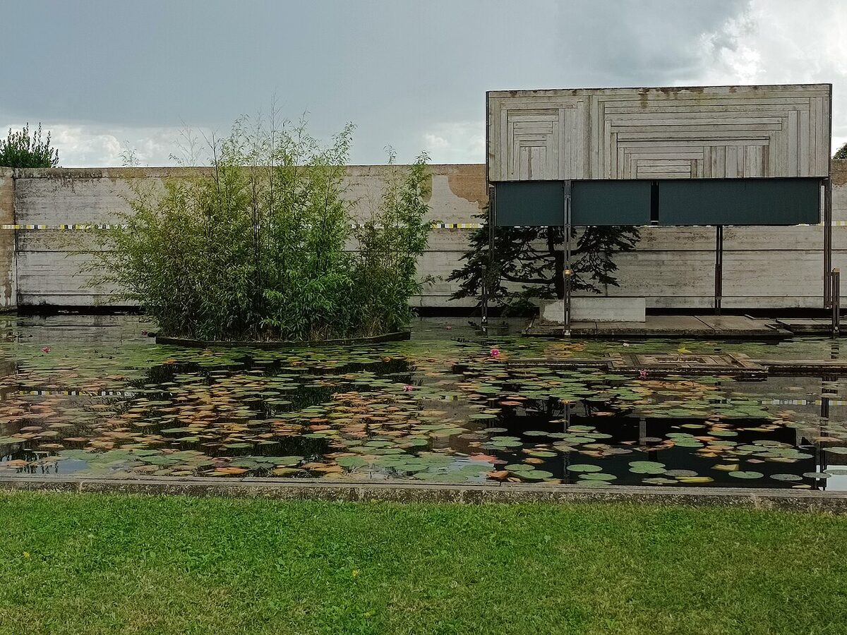 The meditation pavilion floating on the reflecting pool at the Brion tomb.